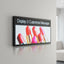 square LED window sign with black metal frame displaying vibrant colorful content