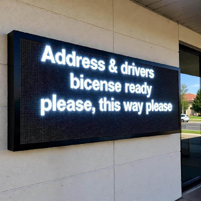 Digital display board with text on a building exterior