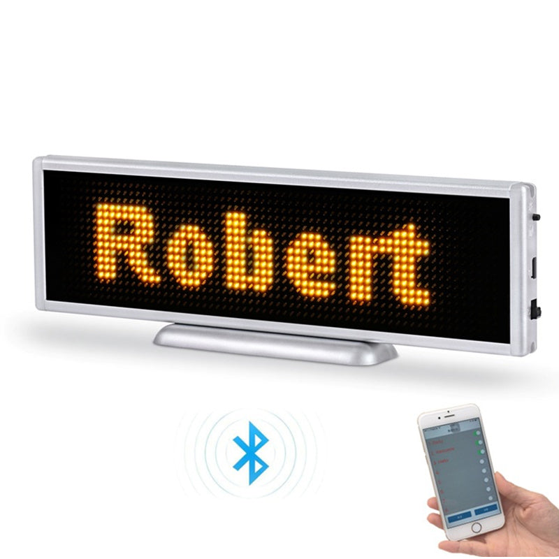 LED display board with 'Robert' on it, connected to a smartphone via Bluetooth, on a white background.
