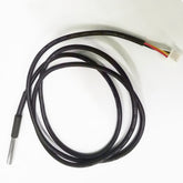 Thermocouple with black cable on a white background
