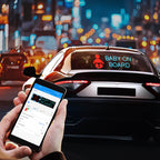 Car with 'Baby on Board' sign and person holding a smartphone with app interface, city lights in the background