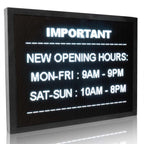 Digital display board with opening hours text on a white background