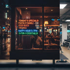 LED window display mounted in coffee shop window showing daily specials