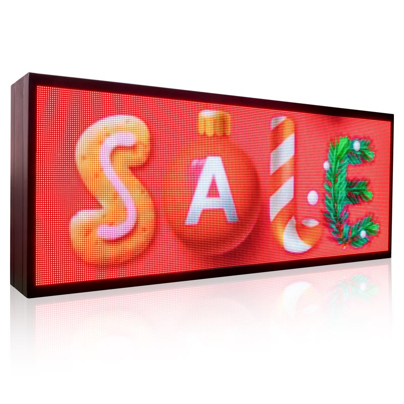 LED sign with 'SALE' and Christmas-themed decorations on a red background