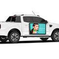 White pickup truck with a digital display showing a woman's face and 'ALISA' branding.