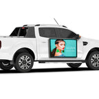 White pickup truck with a digital display showing a woman's face and 'ALISA' branding.