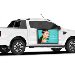 White pickup truck with a digital display showing a woman's face and 'ALISA' branding.