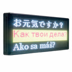 Multilingual electronic display board with text in Japanese, Russian, and Slovak.