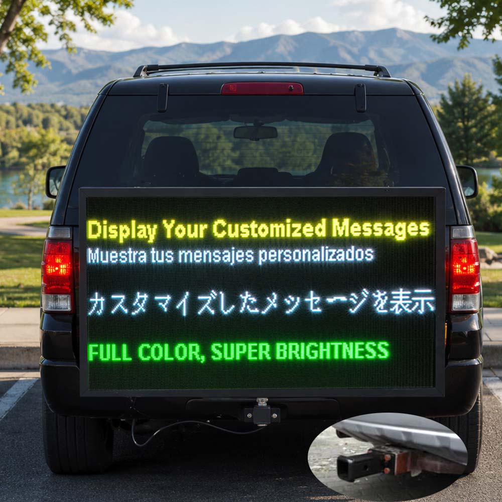Car with a digital display board showing customizable messages outdoors.