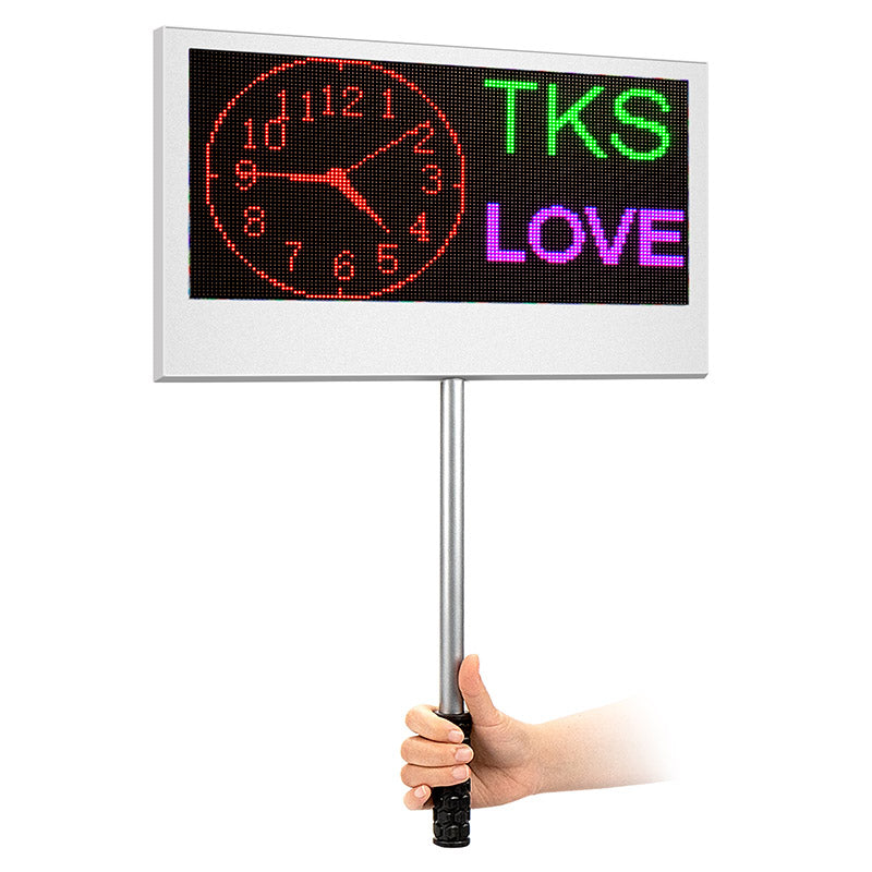 LED display board with clock and text 'TKS' and 'LOVE' held by a hand 