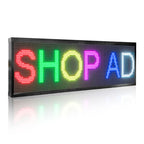 LED sign displaying the word 'SHOP AD' in colorful letters on a white background