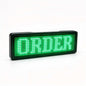 White LED digital scrolling name tag attached with magnetic pin to work uniform displaying HELLO text message