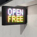 Digital sign displaying 'OPEN FREE' on a light-colored wall.
