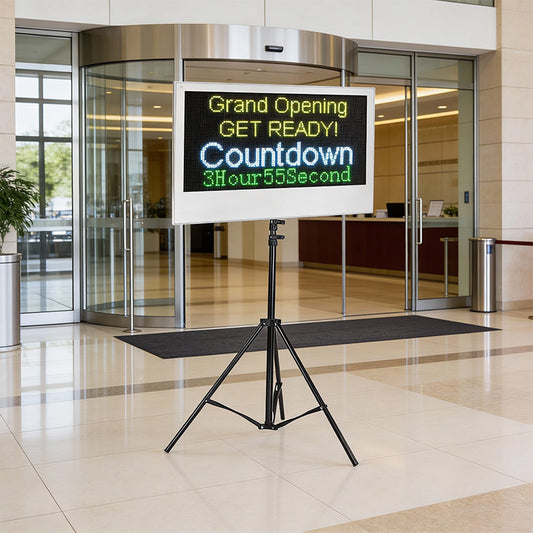 Digital display board with countdown timer in a modern building entrance