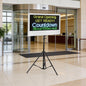 Digital display board with countdown timer in a modern building entrance