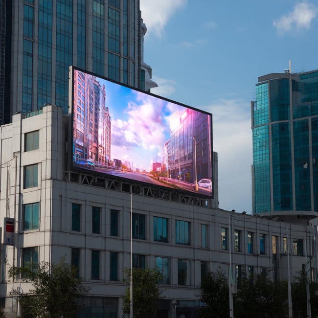 A large outdoor LED billboard mounted on a modern building Main image