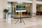 Digital display board with countdown timer in a modern building entrance