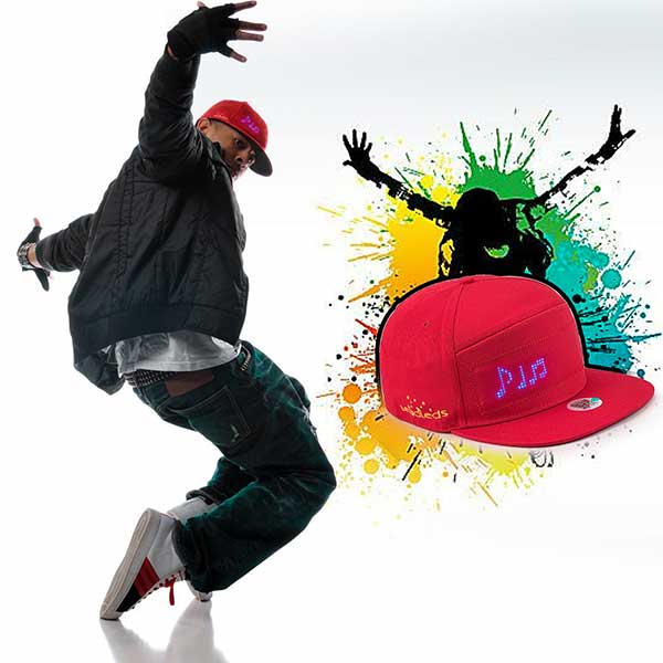 A person wearing a red snapback cap with LED lights displaying the text 'Dj' in a bright display mode, against a white background with a colorful graphic splash. Main image